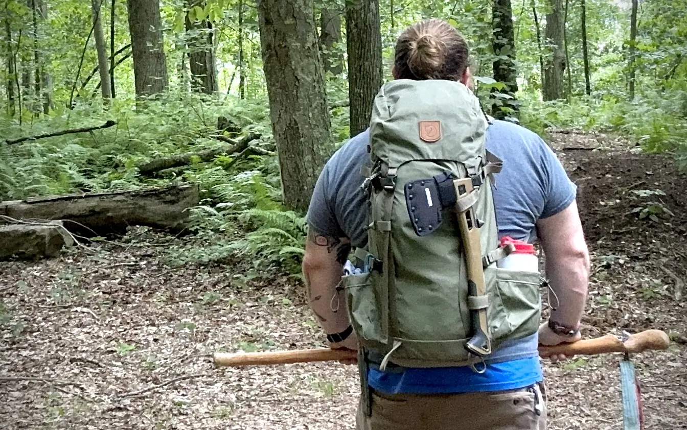 man wearing packed fjallraven kajka 35 pack
