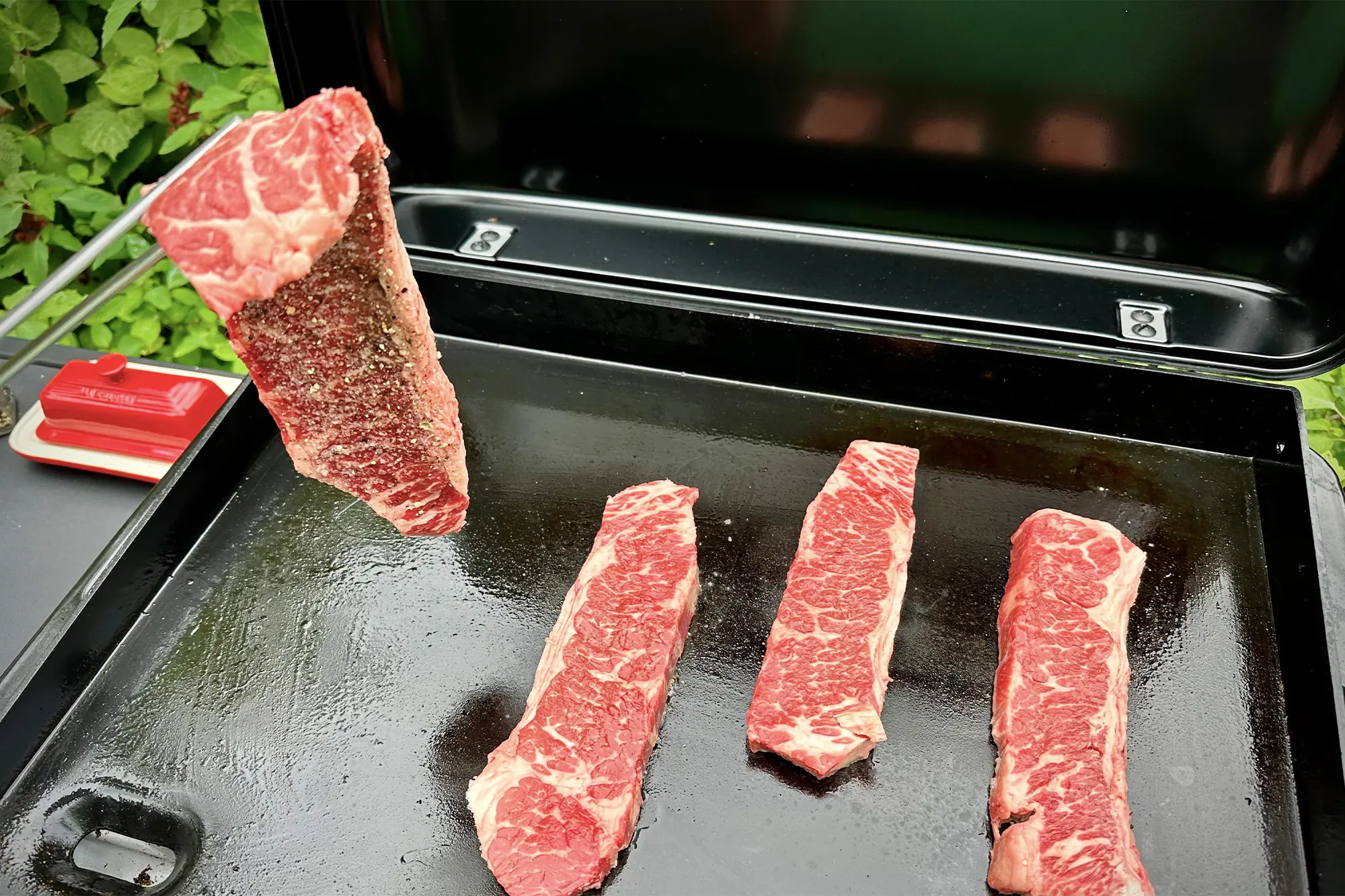 grilling steaks on weber traveler 22 griddle