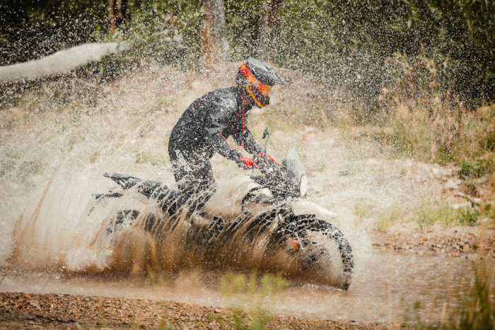 Seiji Ishii crossing a creek on the Royal Enfield Himalayan 450