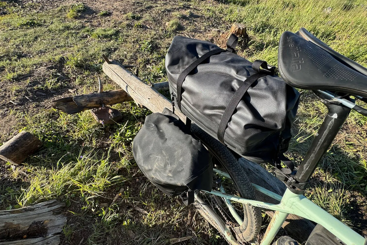 Close-up of a mountain bike with Tailfin rear panners and AeroPack
