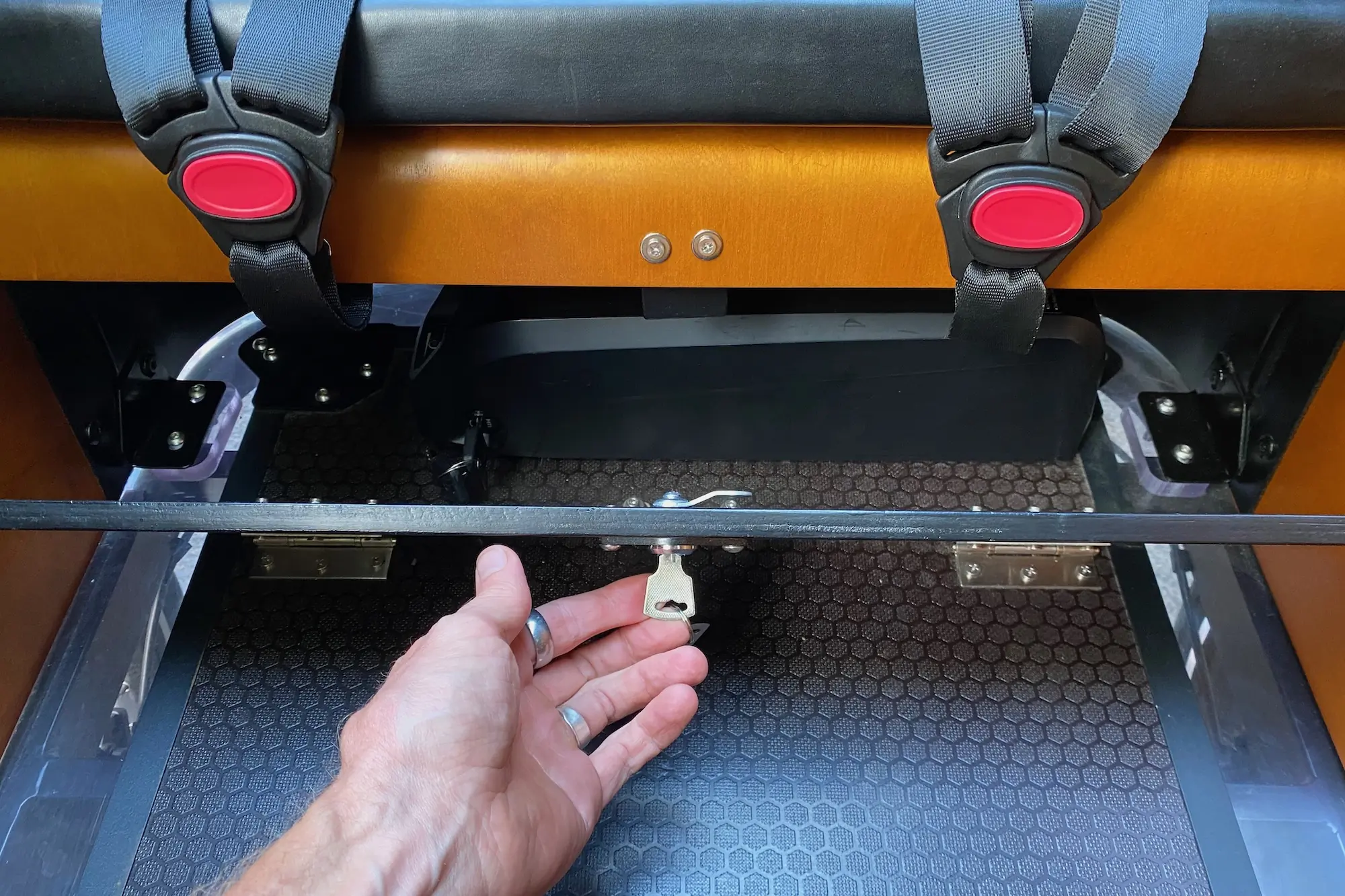 A look at the battery housed beneath the bench seat in the cargo box of the Ferla Royce 2 electric cargo bike