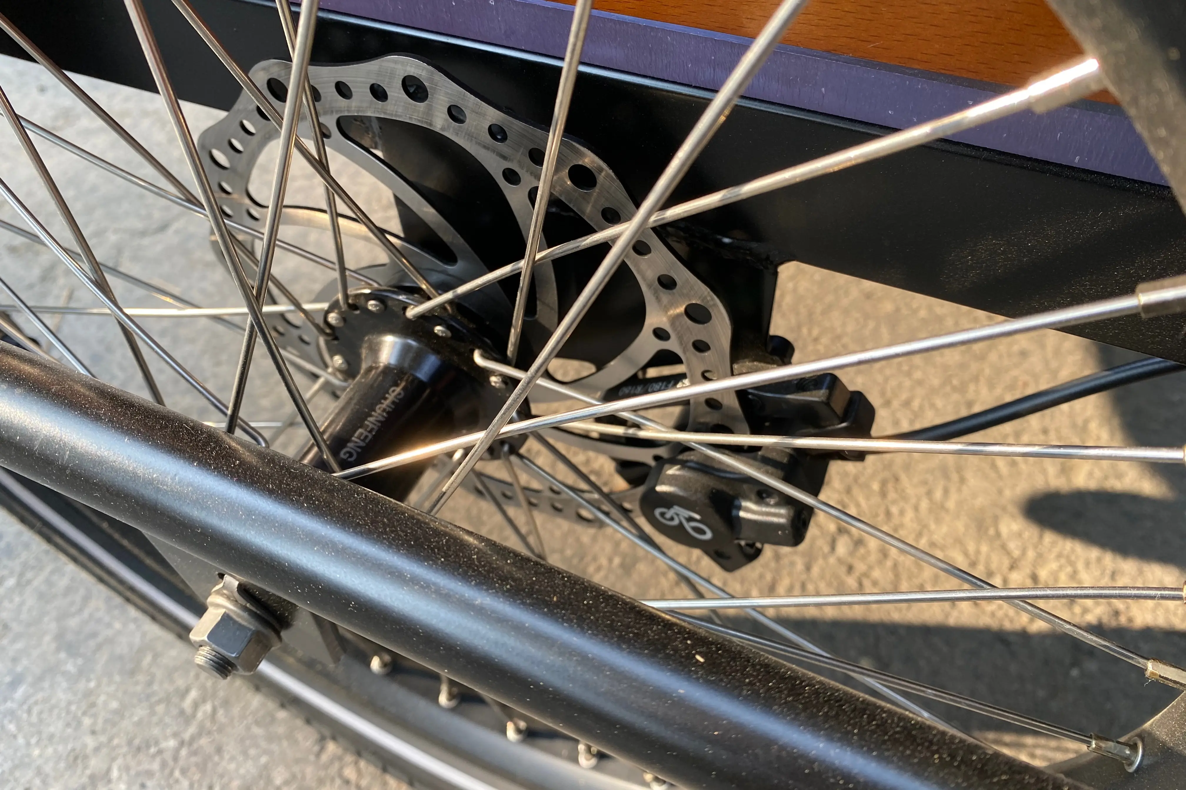 The hydraulic disc brake rotor and caliper on the Ferla Royce 2 electric cargo bike