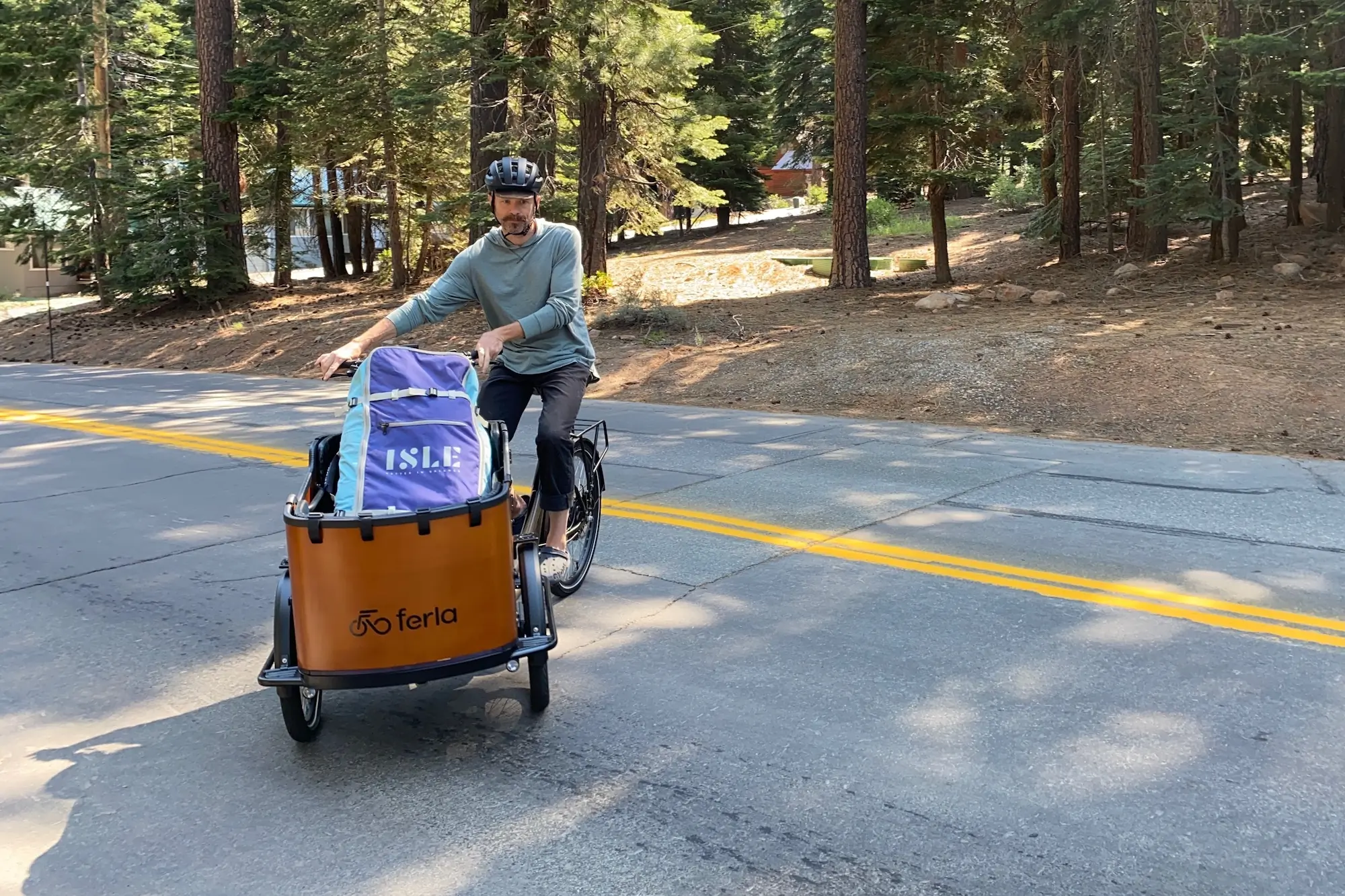 The author turning around in a road while riding the Ferla Royce 2 electric cargo bike