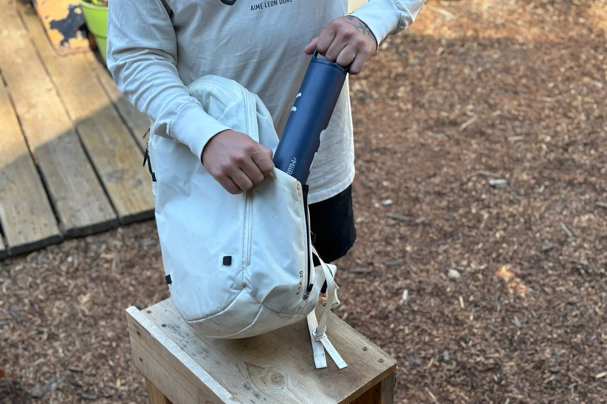 Slipping the Miir Widemouth into a backpack pocket