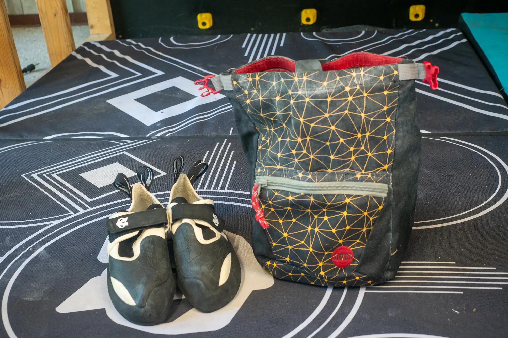 Evolv Zenist climbing shoe on bouldering pad