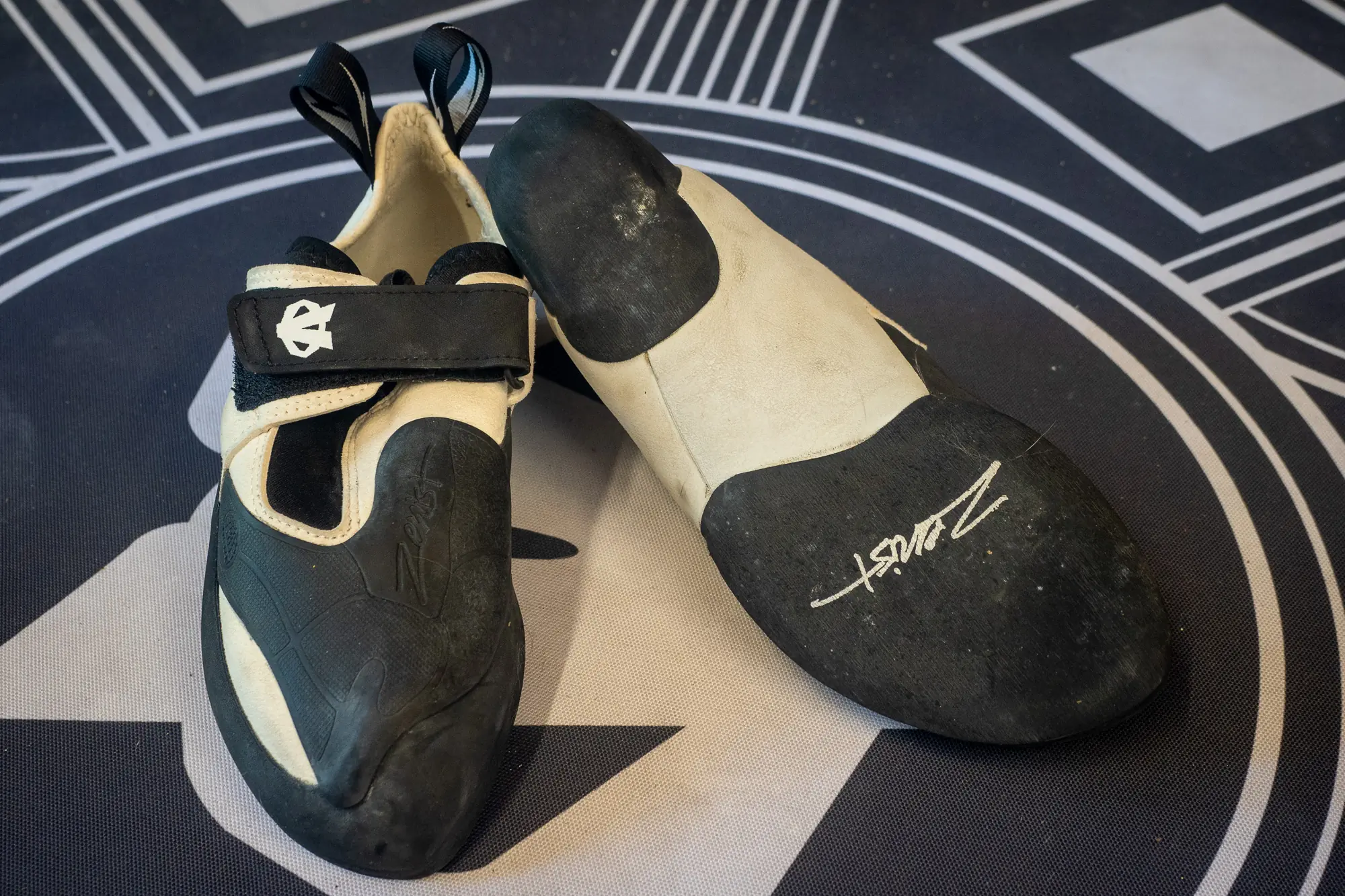 Evolv Zenist climbing shoe on bouldering pad