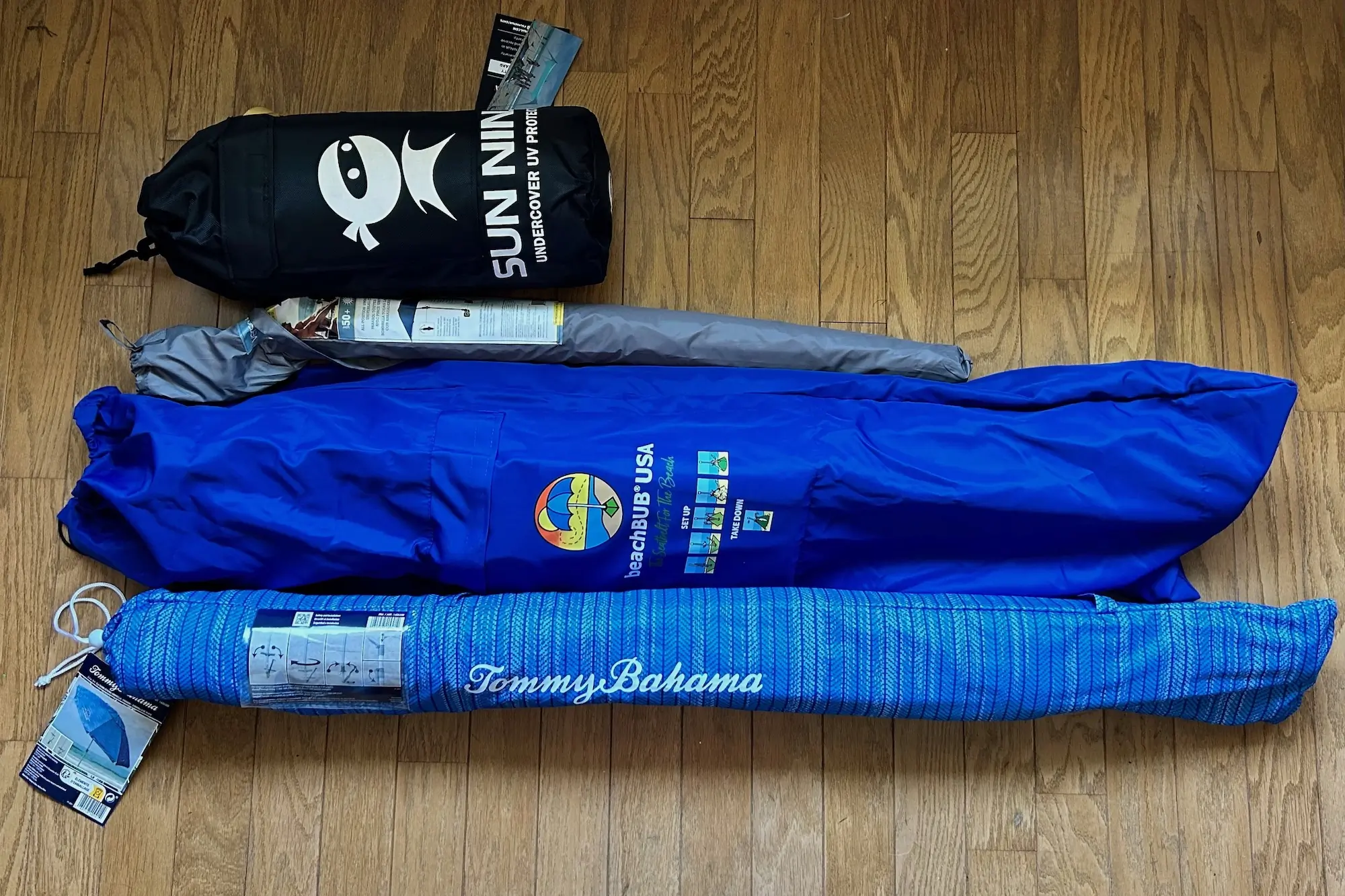 A comparative look at the packed size of the Sun Ninja Tent versus traditional beach umbrellas