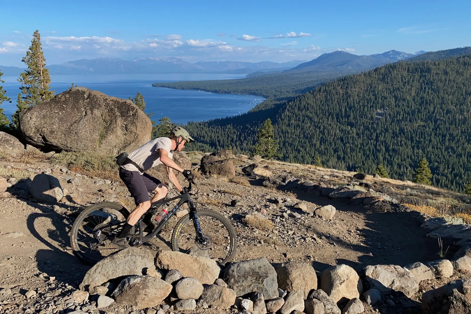 The author testing the Sweet Protection Primer MIPS mountain bike helmet high above lake Tahoe