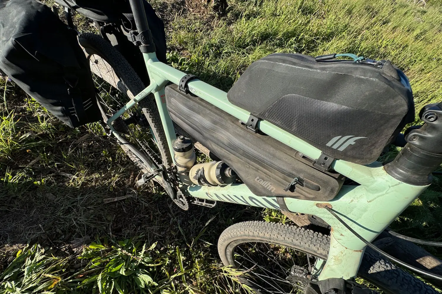 Top-down view of a loaded gravel bike with Tailfin frame and top tube bag