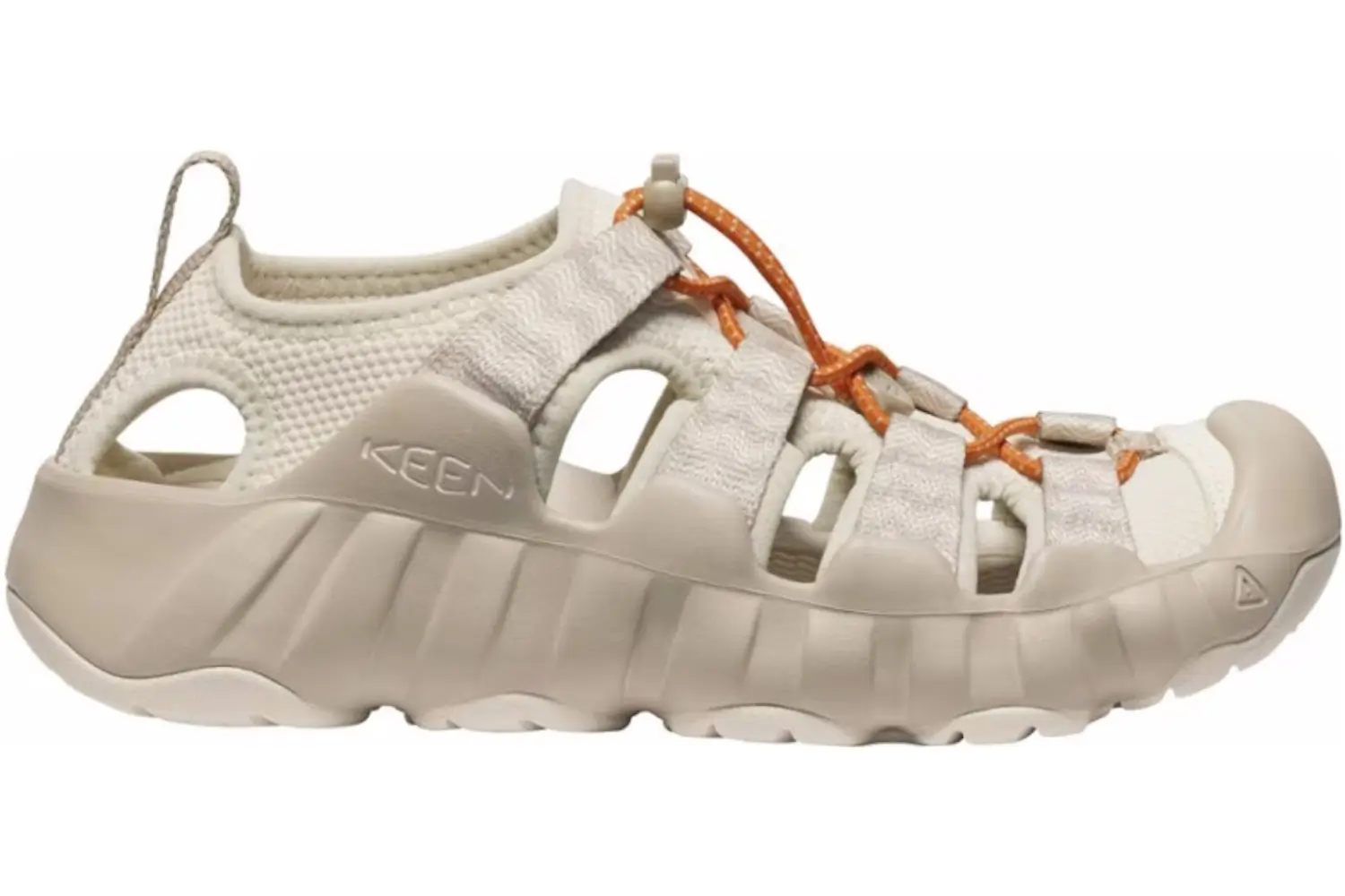 KEEN Hyperport water shoes being worn while crossing a mountain stream