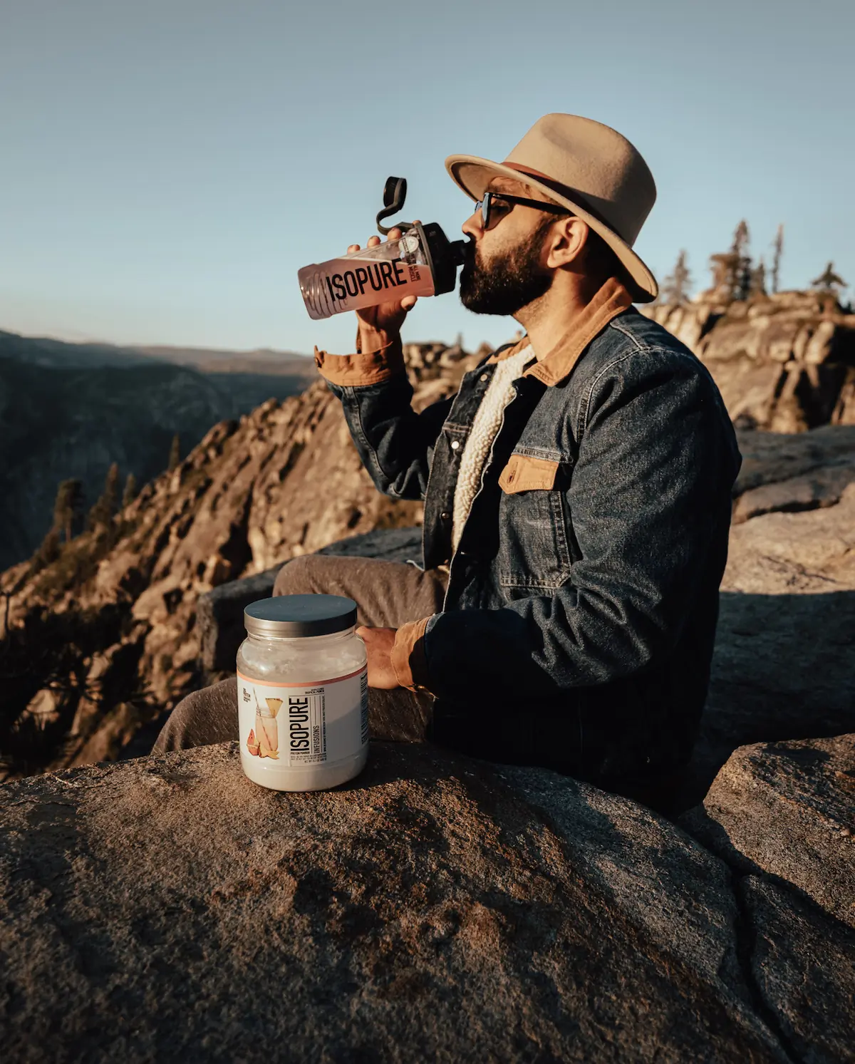 man drinking from isopure shaker