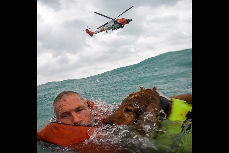 Watch: Man and Dog Rescued From Disabled Boat During Hurricane Helene