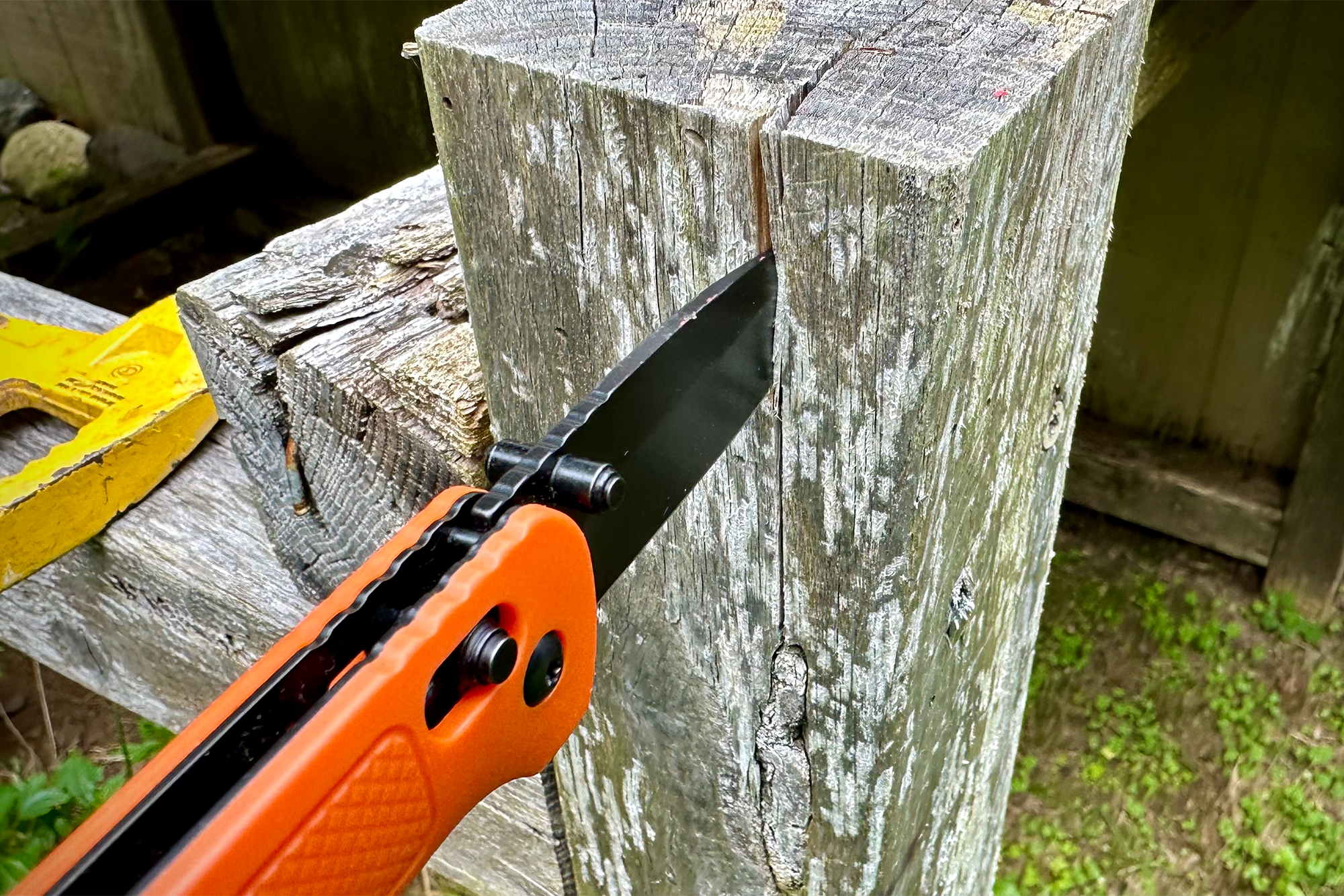 ozark trail 7.5in knife wedged into piece of wood