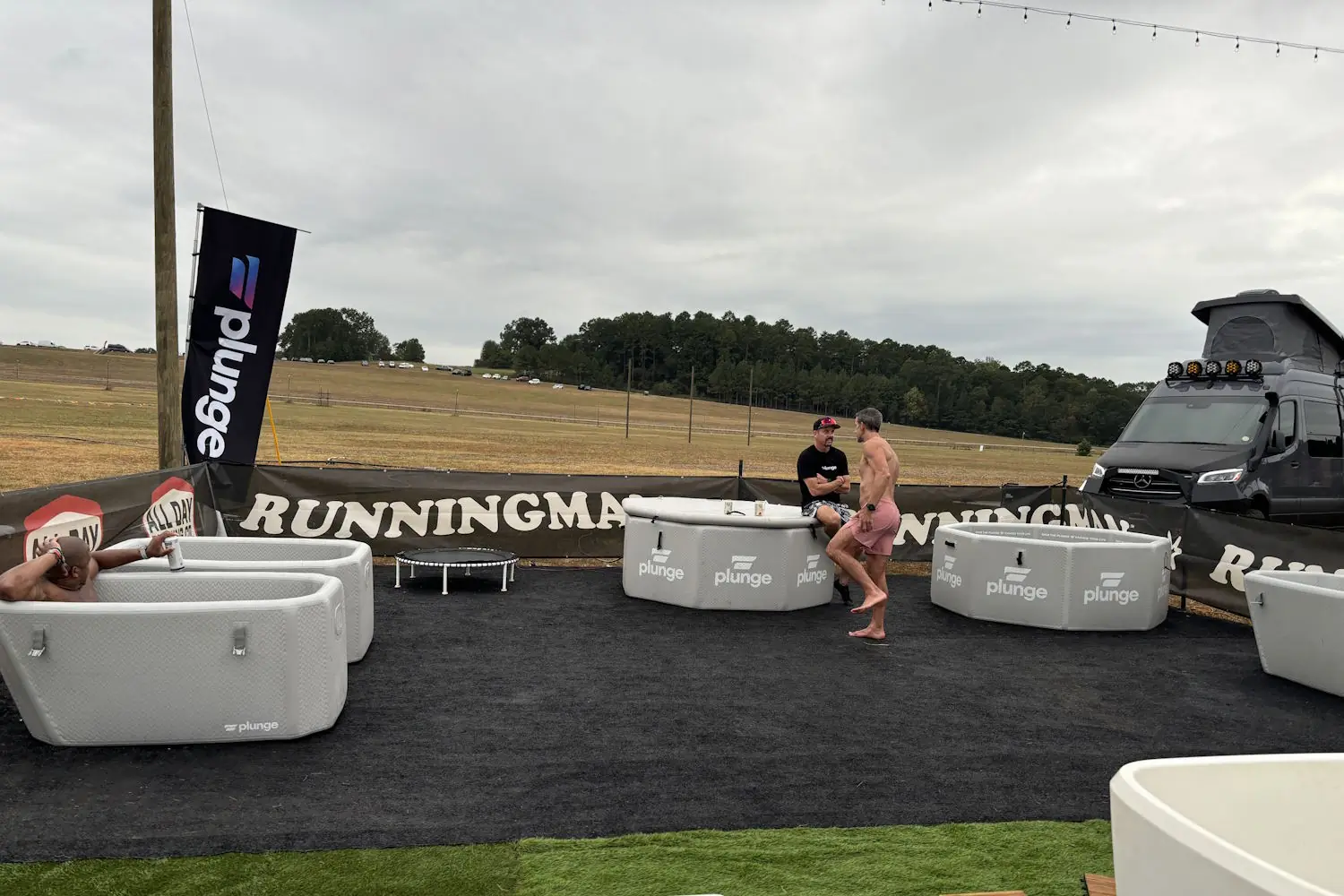 People relaxing in cold plunge tubs