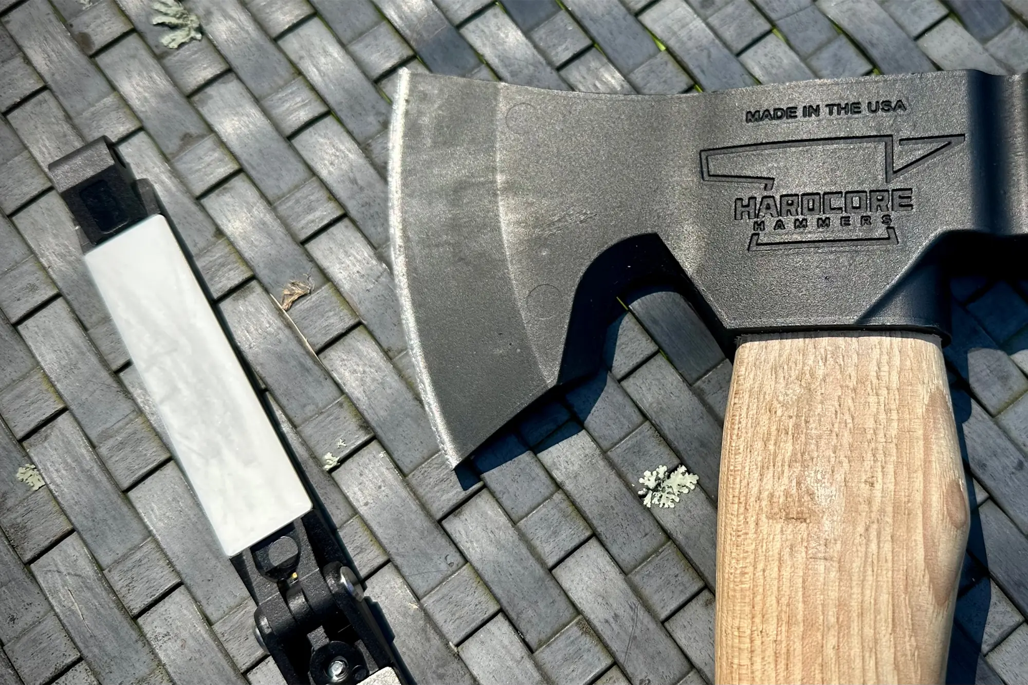hatchet and with work sharp folding field sharpener next to each other