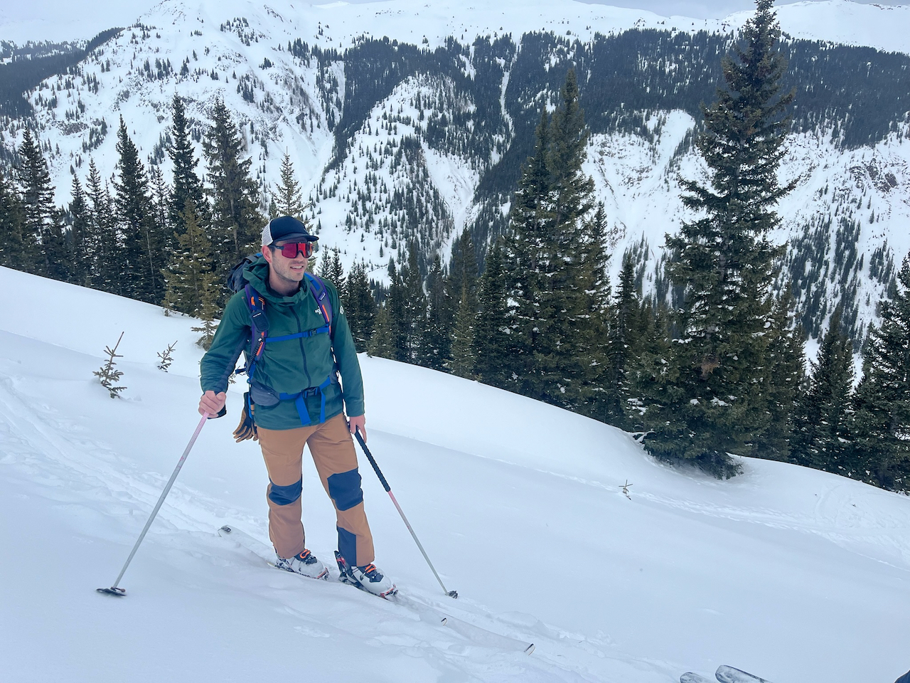 man wearing wndr nocturne 88 skis on the ski slope