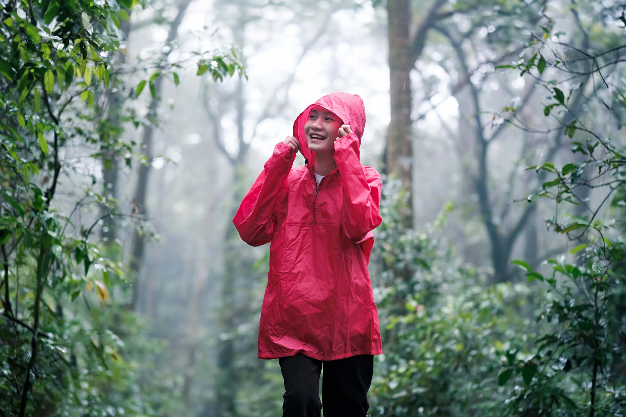 woman hiking in rain