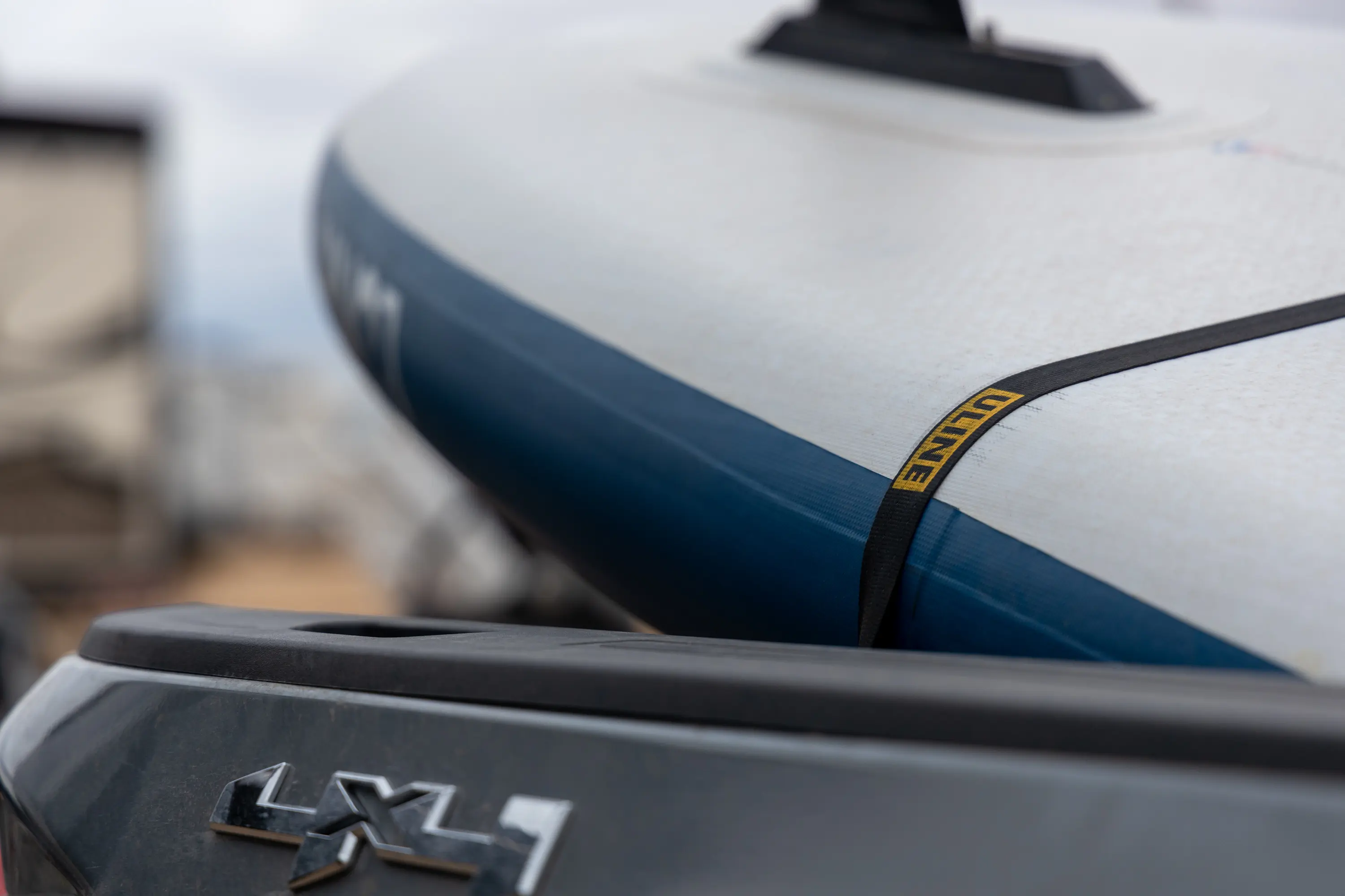 Using the Uline Retractable Tie Downs to secure a SUP; (photo/Chip Jordan)