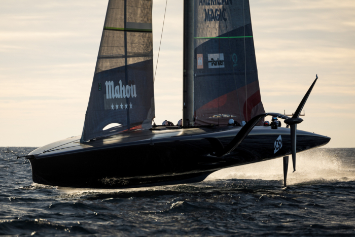 American Magic "Patriot" foiling over the ocean near Barcelona