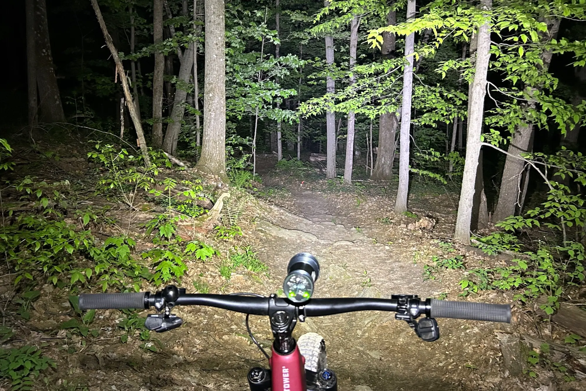The high setting of the Exposure Six-Pack Mk13 lighting up a trail on a night ride