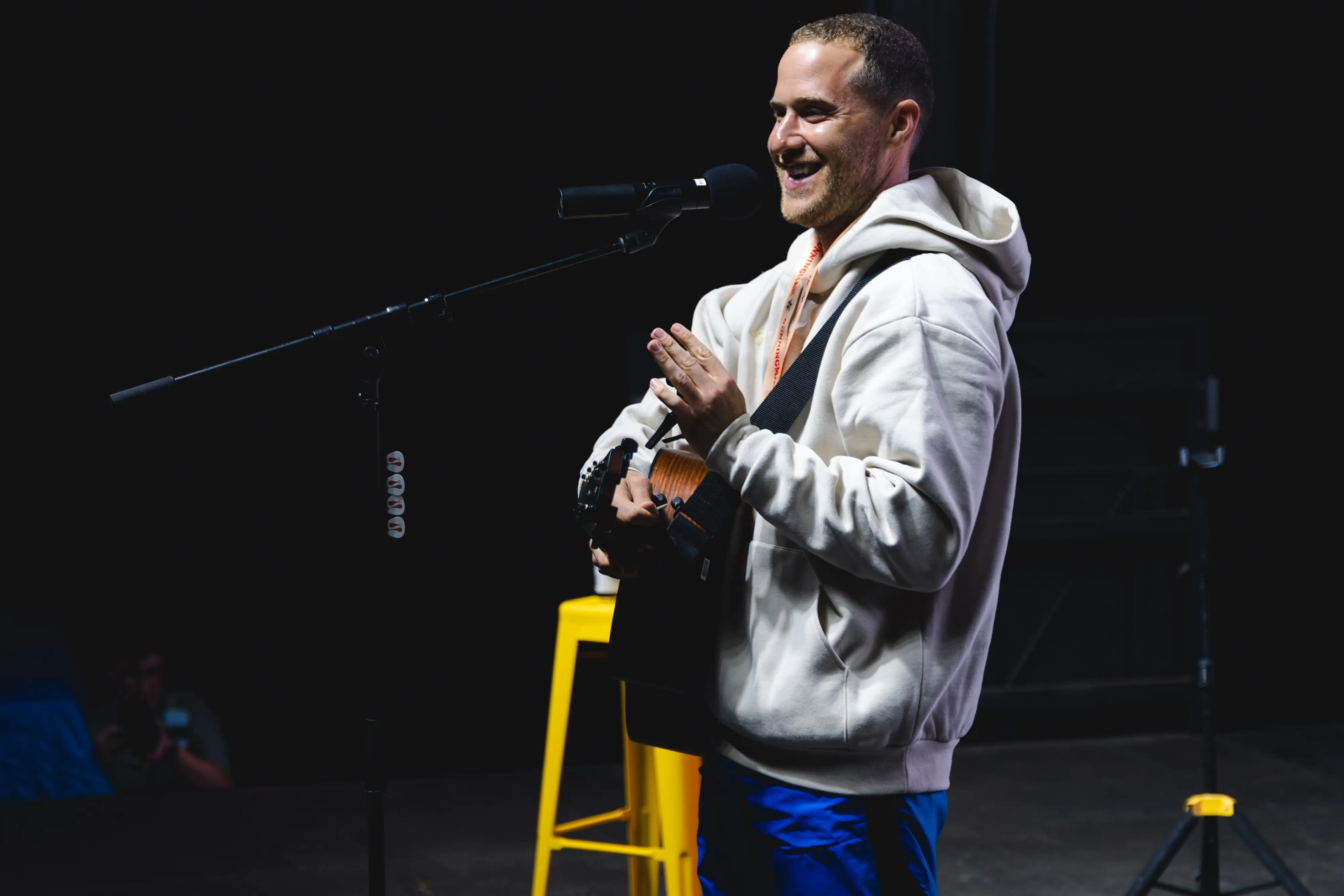 mike posner plays guitar on-stage at Runningman Festival