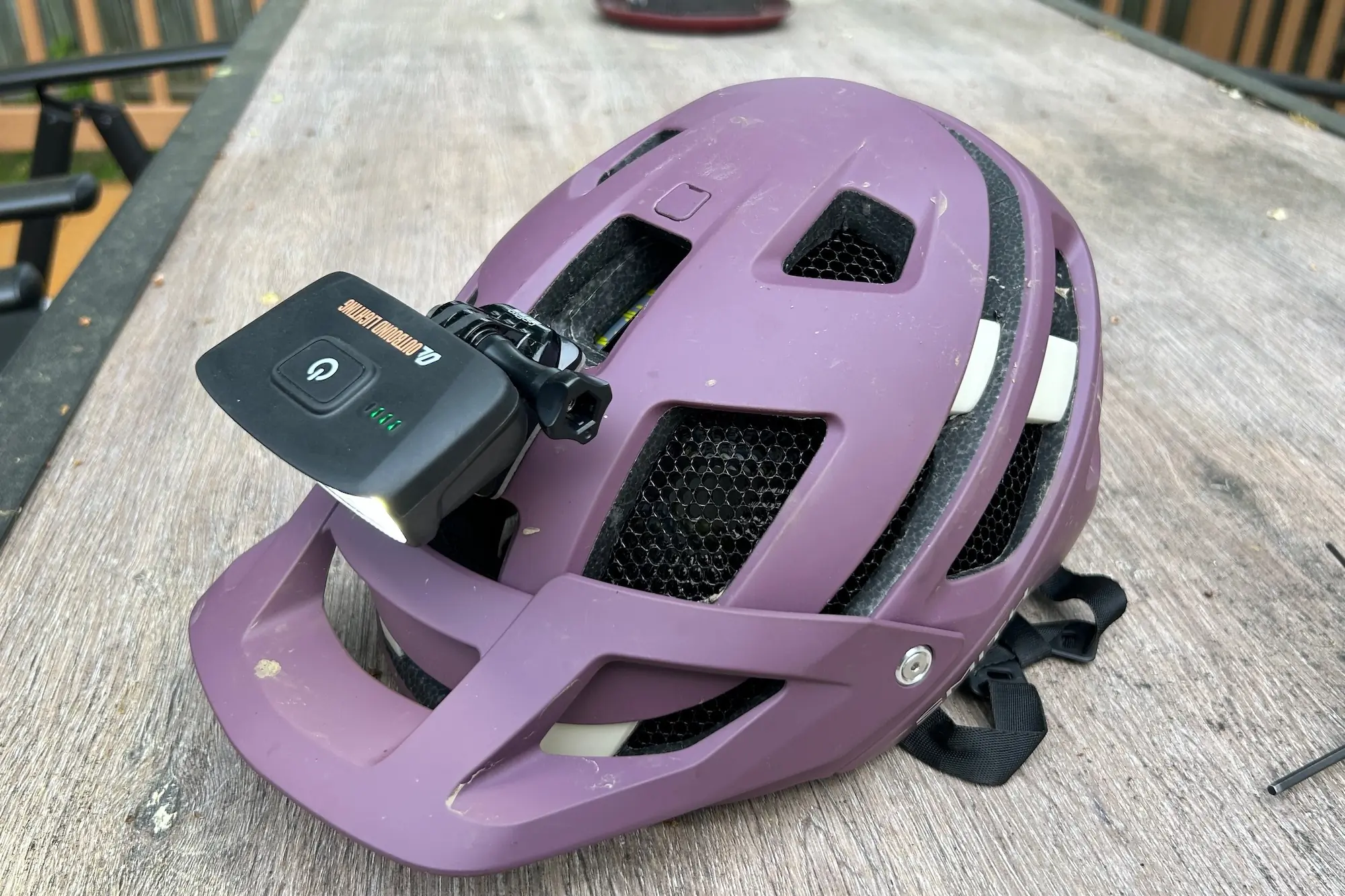 The Outbound Lighting Hangover mountain bike light mounted to a mountain bike helmet