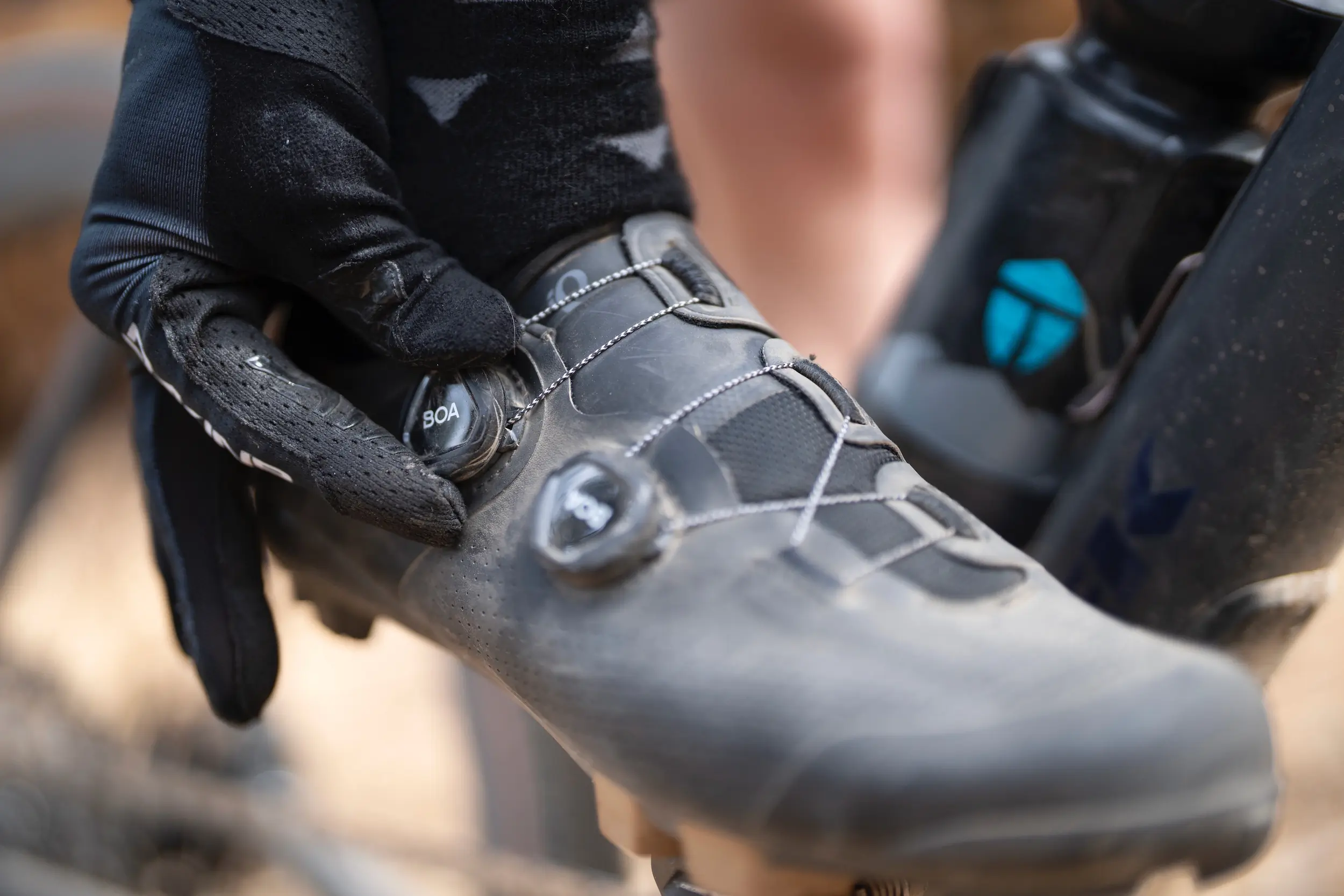 Tightening the BOA dial on the Pearl Izumi Expedition PRO gravel bike shoes