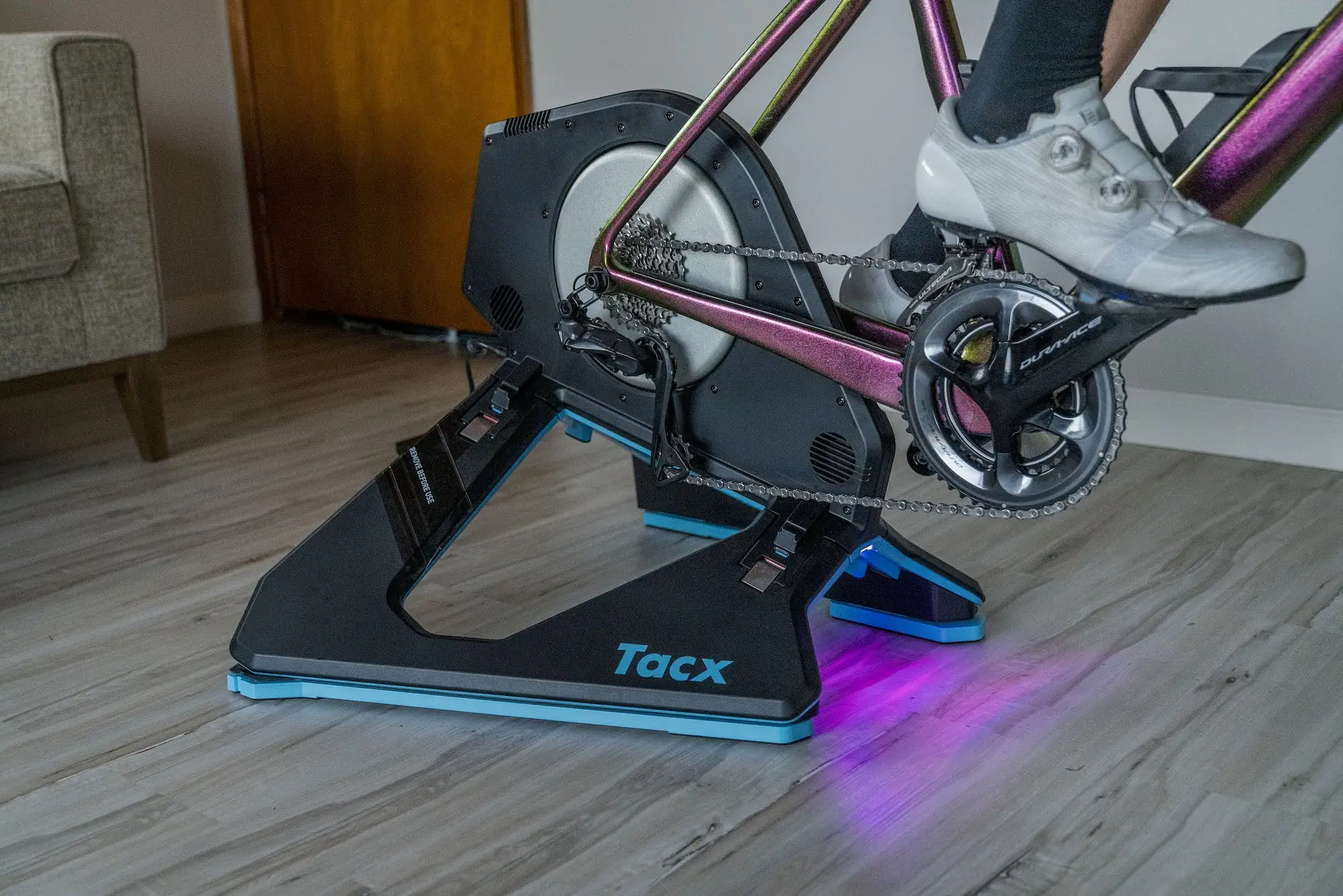 The TacX Neo motion plates attached to the feet of the TacX Neo 2T bike trainer