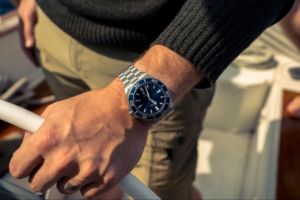 A close-up of a Lake Michigan Monster dive watch on a man's wrist