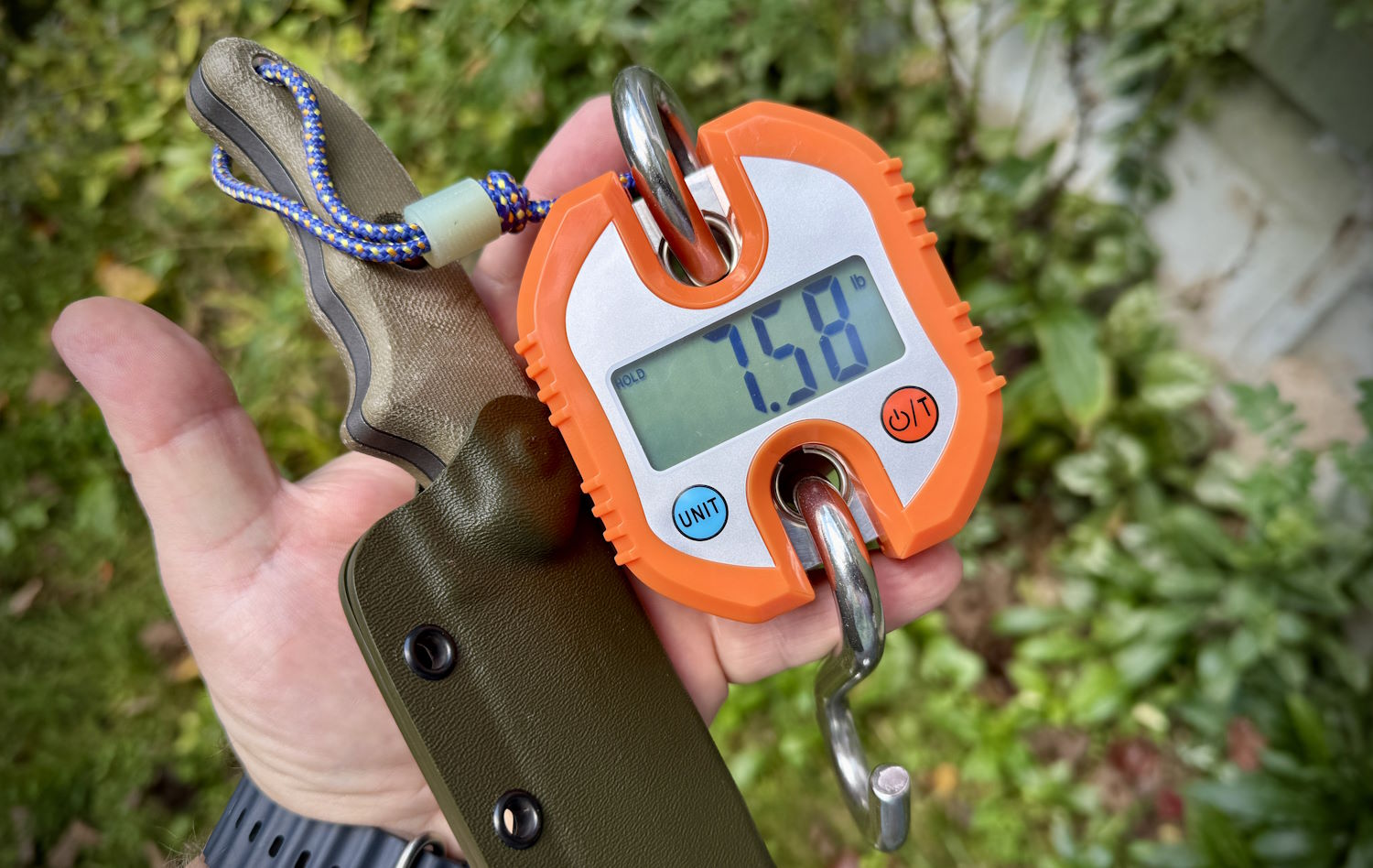 Scale showing 7.58 lbs pull force for a knife sheath
