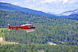 Red,Rescue,Helicopter,Flying,Emergency,Mission,In,Mountains,,Alberta,Canada
