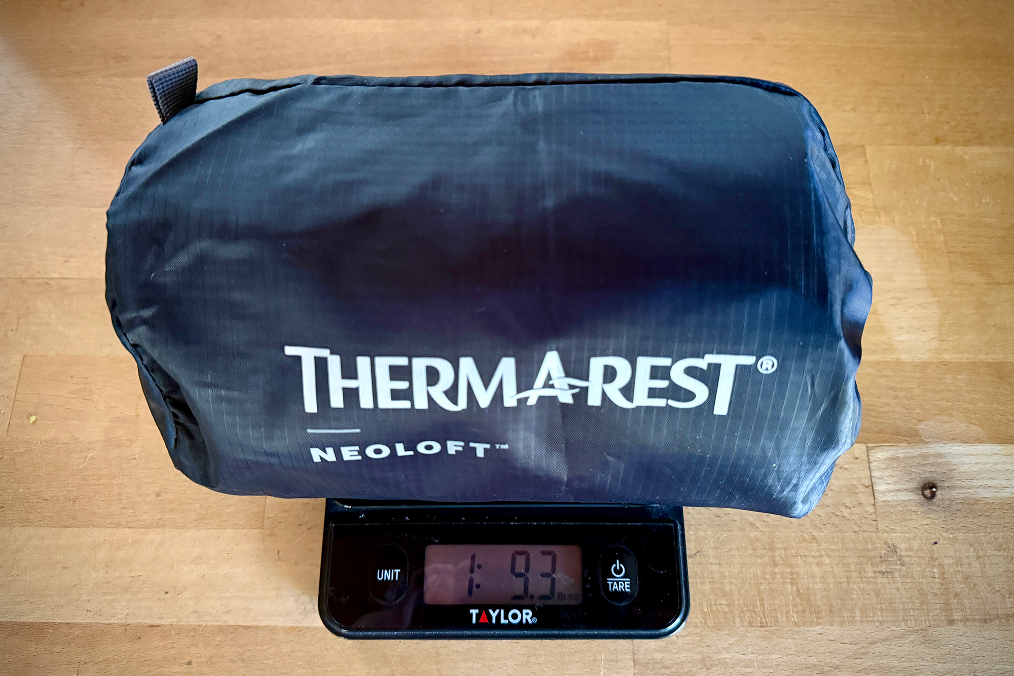 therm-a-rest neoloft packed on scale showing its weight