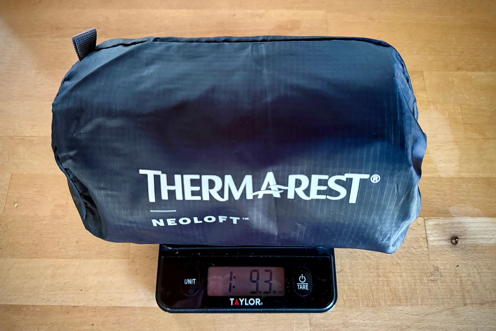 therm-a-rest neoloft packed on scale showing its weight