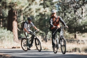 Two testers riding electric commuter bikes for the GearJunkie commuter bike buyer's guide