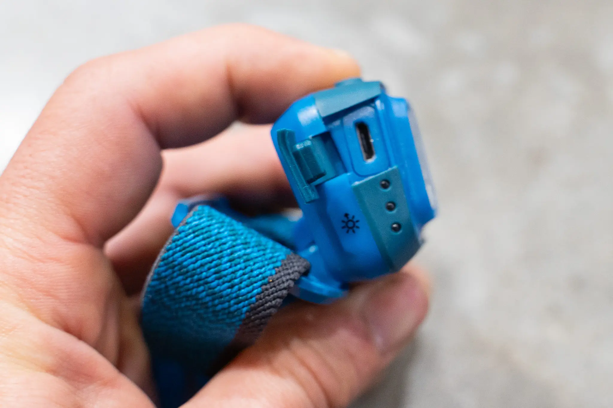 BLue headlamp showing micro USB charing port