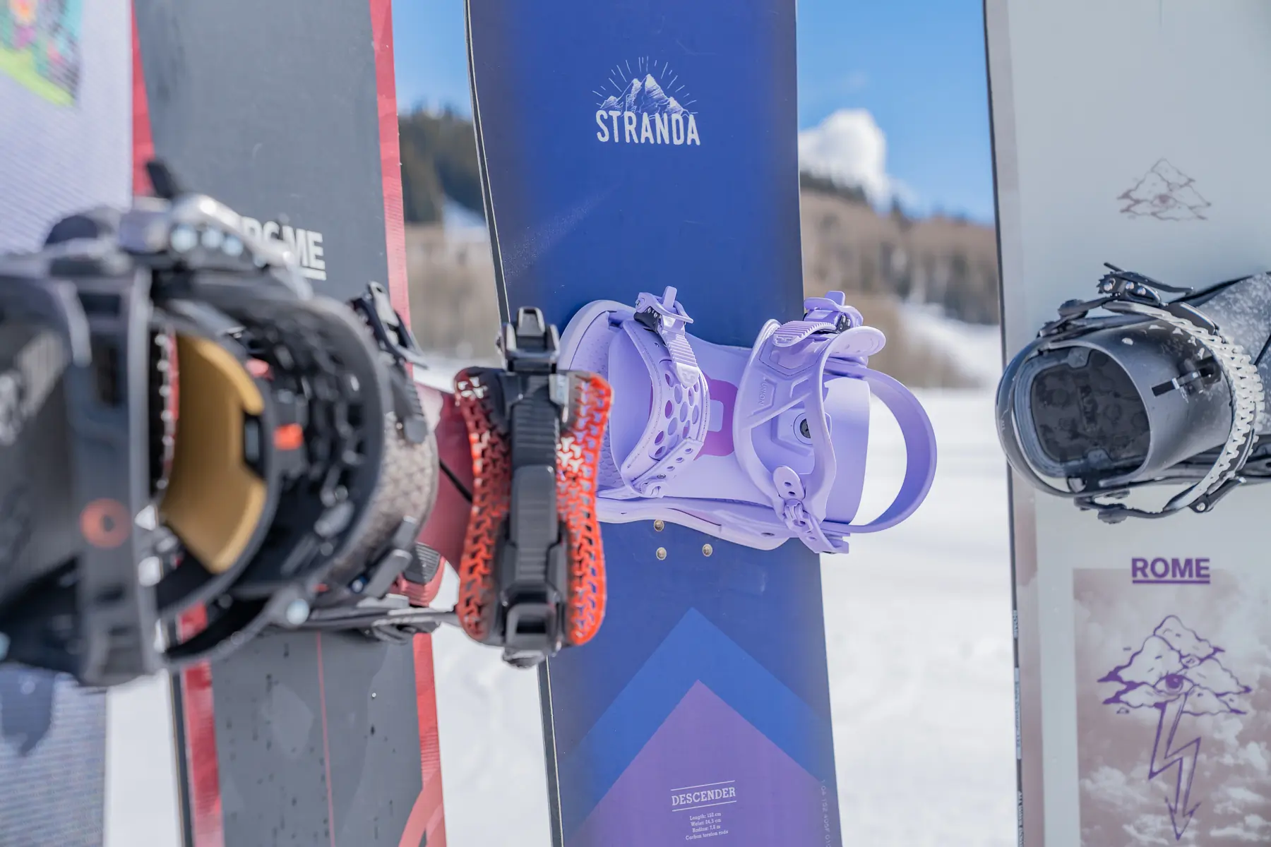 Lineup of snowboards and snowboard bindings; (photo/Eric Phillips)