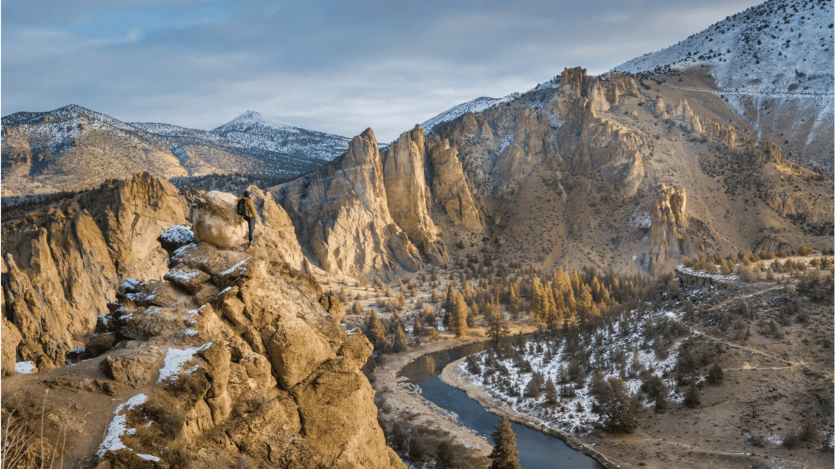 Man hiking at Smith Rock State Park in winter