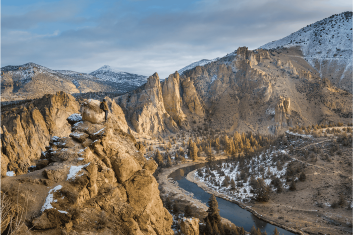 Man hiking at Smith Rock State Park in winter