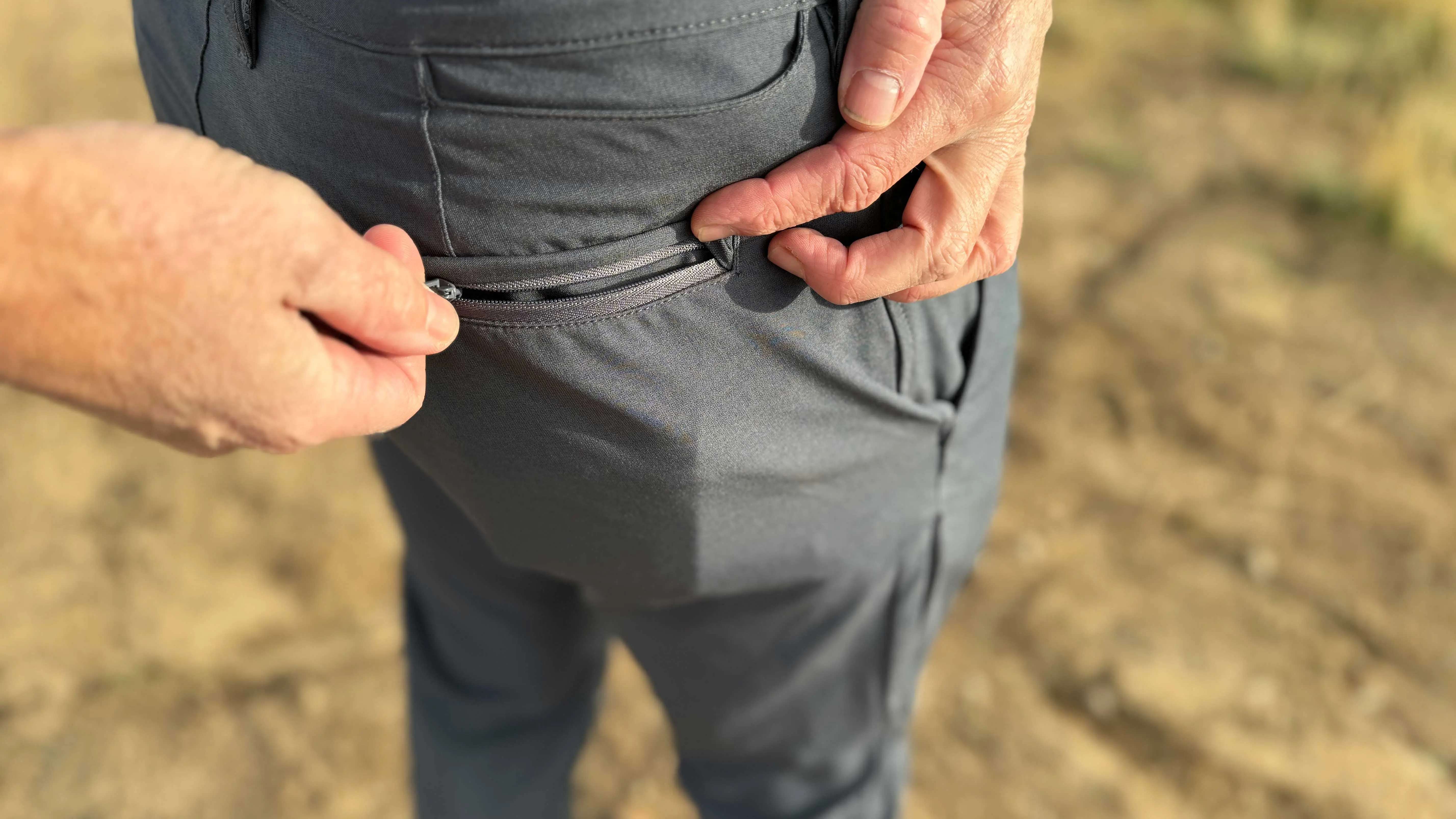 the author shows how the zippered rear pockets on the envoys open and close