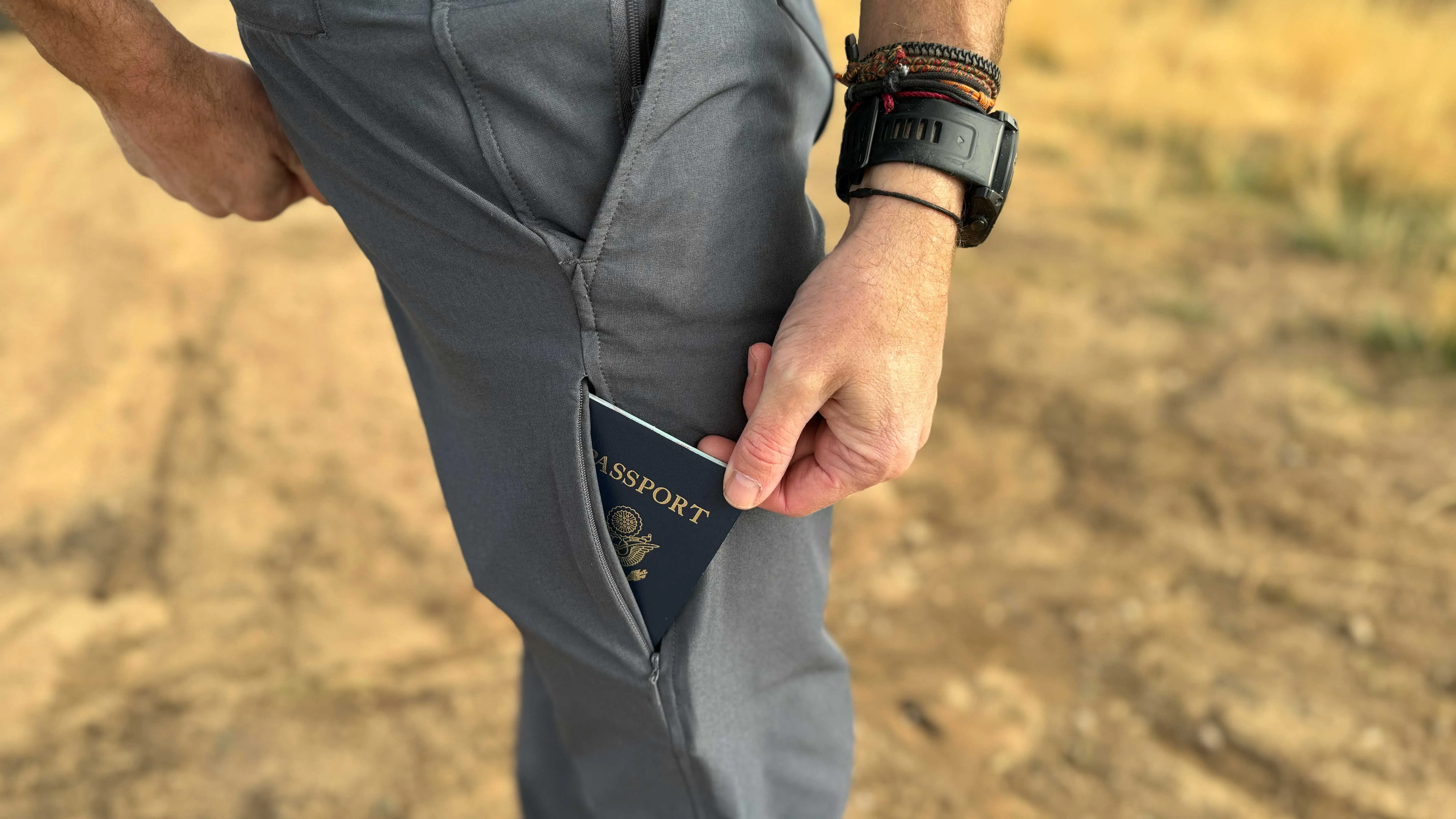 the author places his passport in the hidden slash pocket on the side of the Envoys