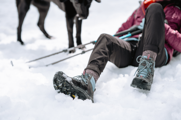 Person lying in snow wearing KEEN Revel IV Polar boots