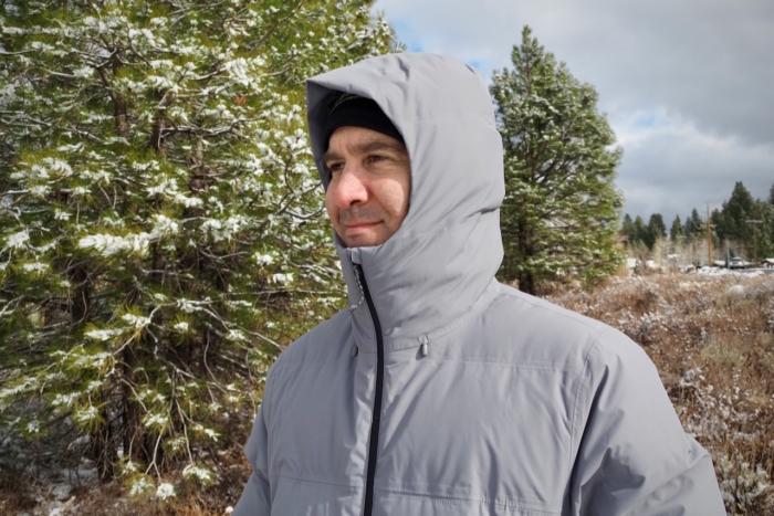 A man wearing the Patagonia Jackson Glacier Parka, demonstrating the hood.