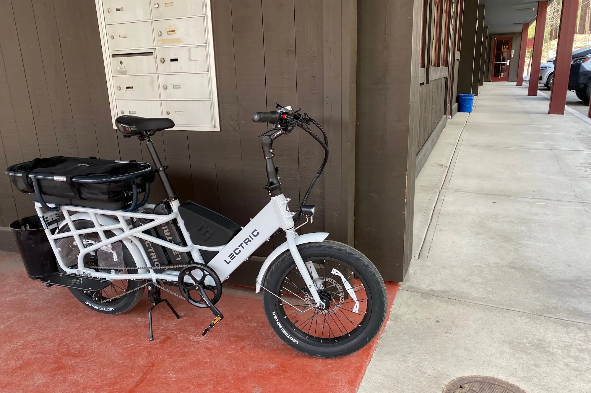 The Lectric XPedition electric cargo bike parked outside an office building