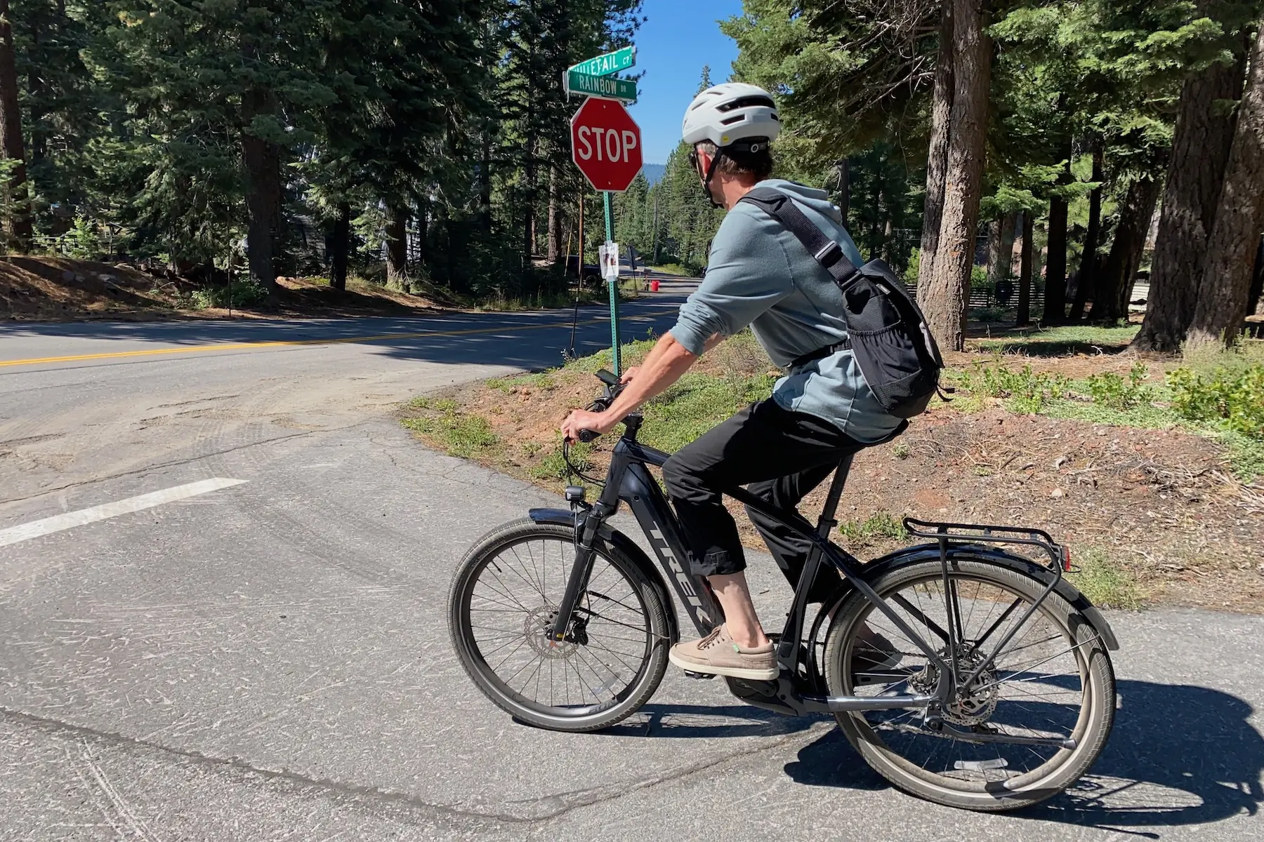 Riding the Trek Allant+ 7S Gen 2 electric commuter bike in a neighborhood