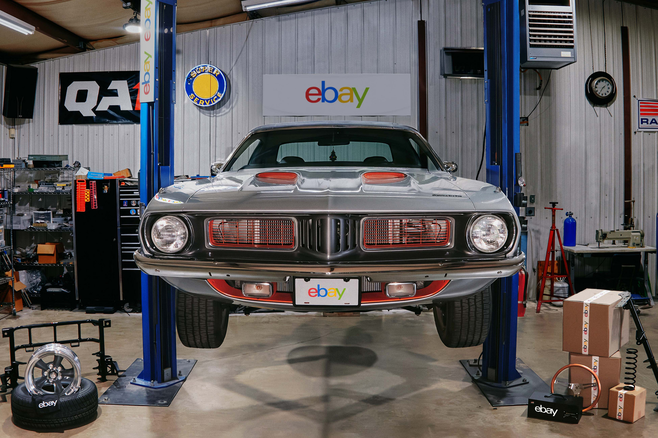 1973 plymouth barracuda on lift before restomod