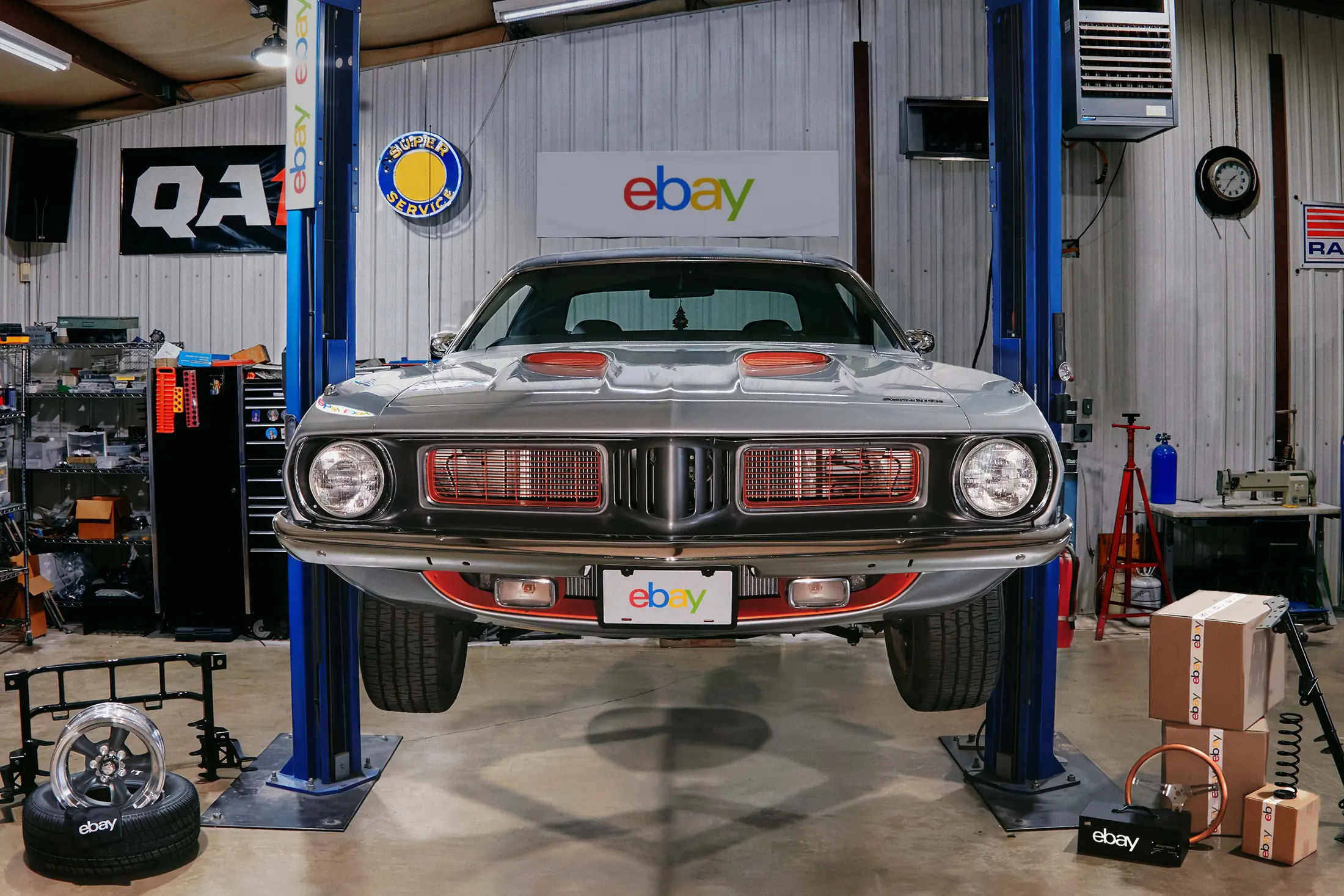 1973 plymouth barracuda on lift before restomod