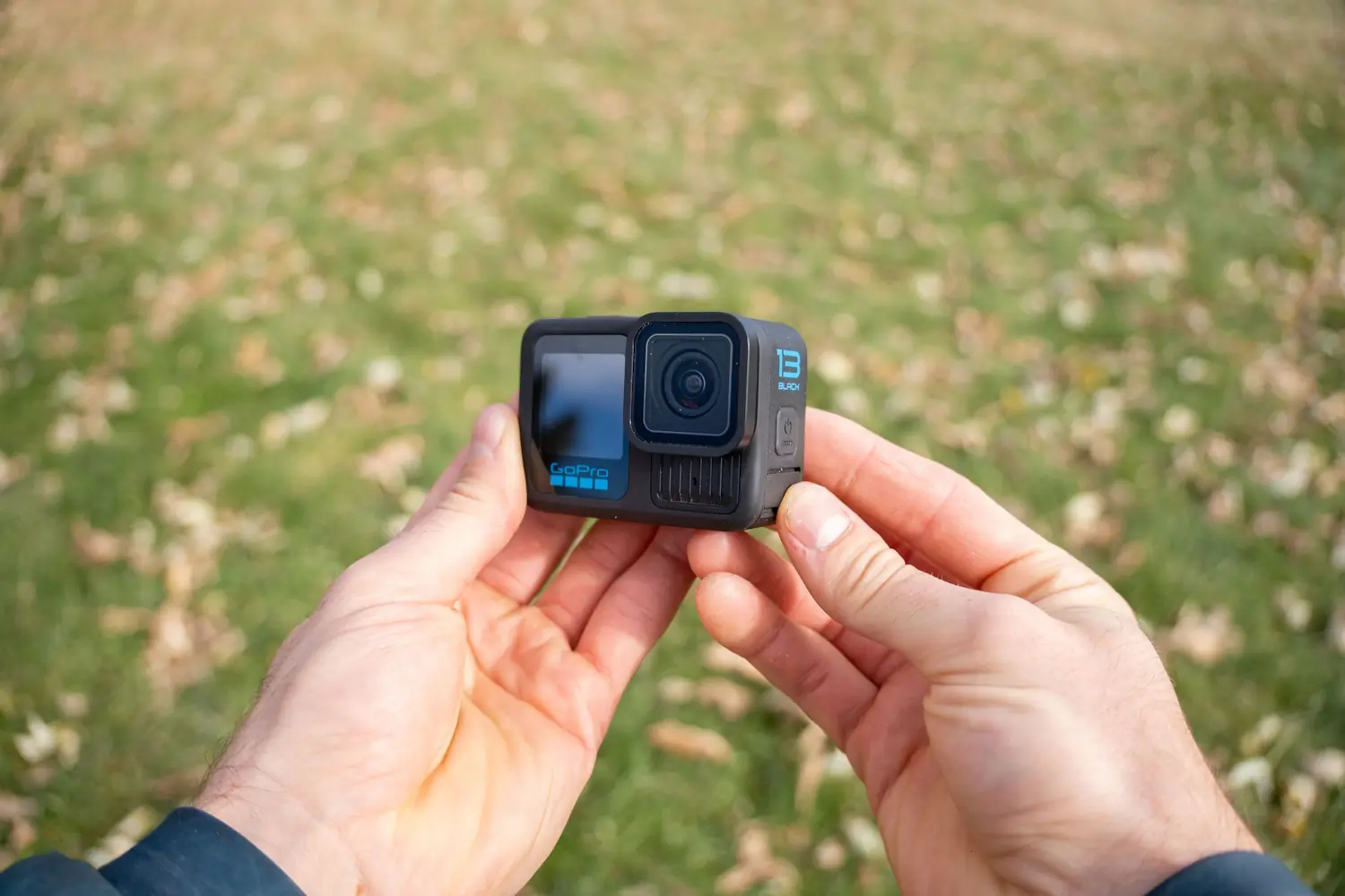 Hands holding a GoPro camera