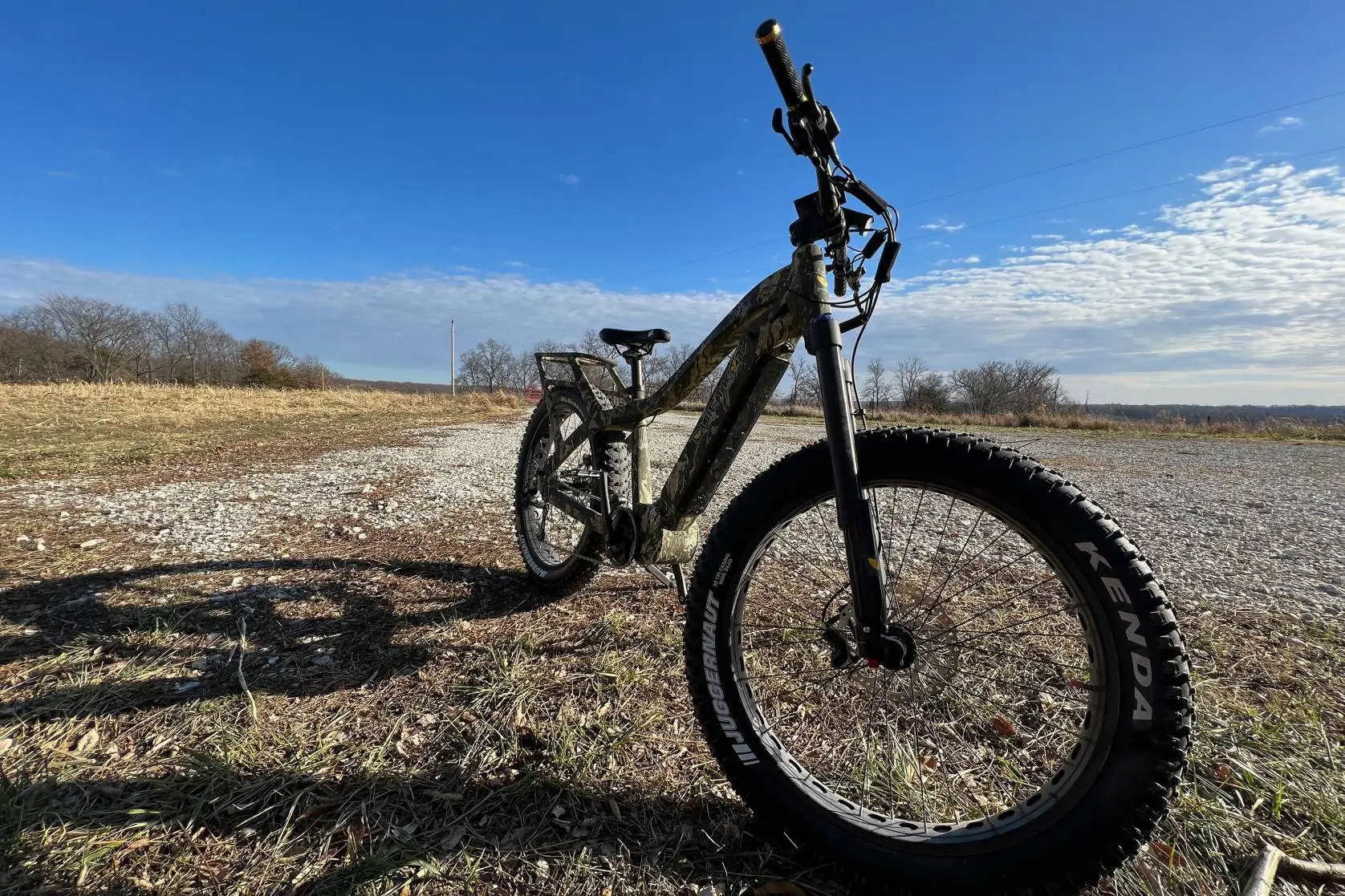 A QuietKat hunting e-bike standing in a field