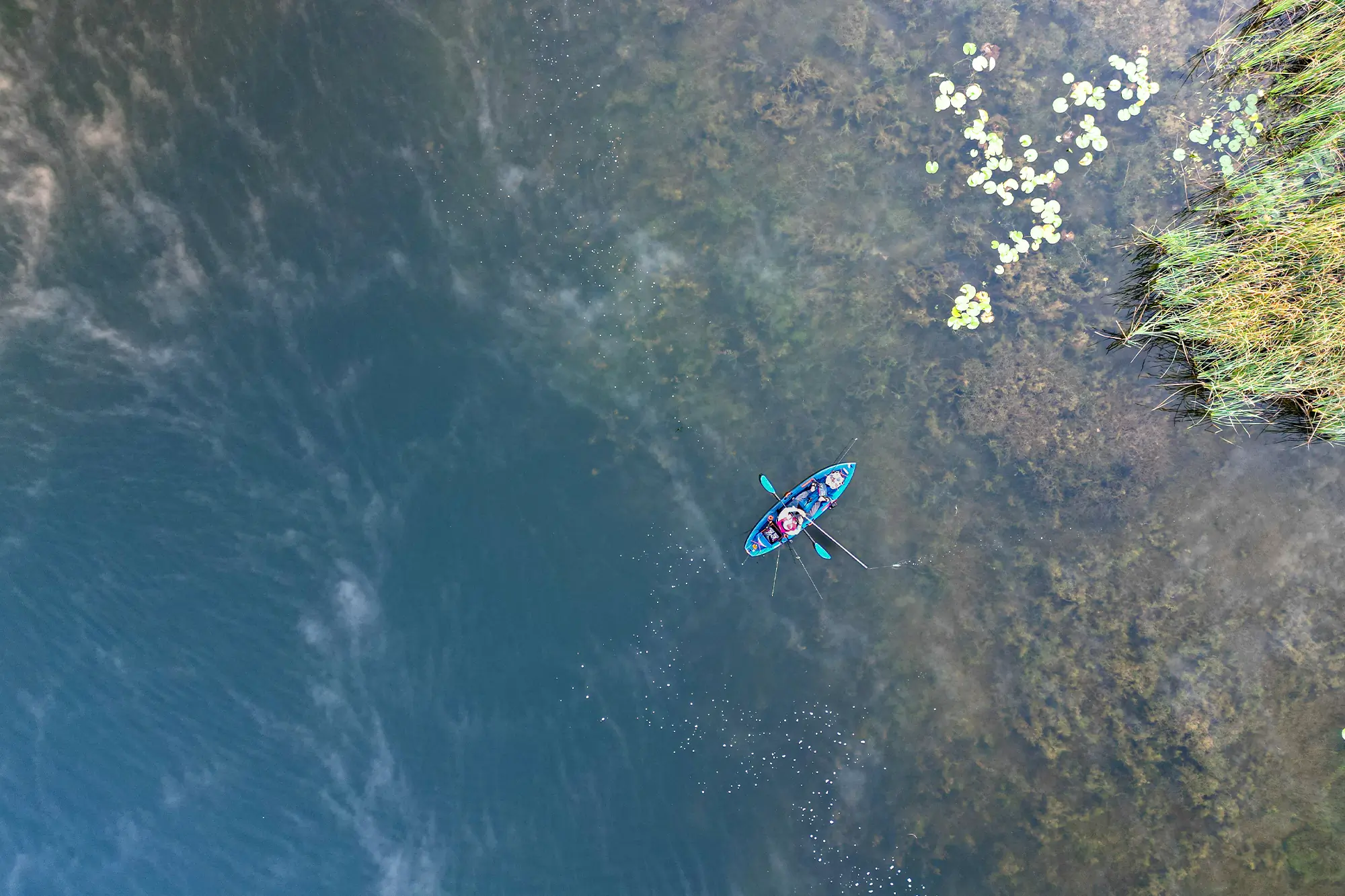 drone photo from above on kayak on the lake