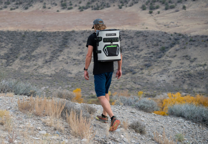 man wearing Engel Roll Top High Performance Backpack Cooler